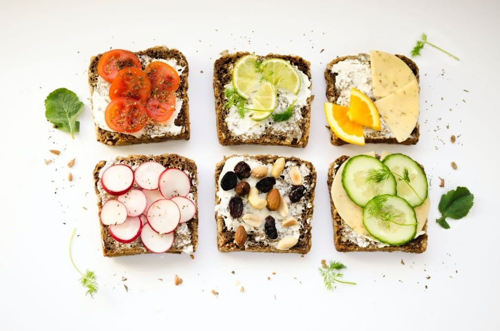 6 open faced bread slices with various toppings